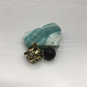 Leaf Pattern Aromatherapy Brass tone Locket.  Lava stone included.
